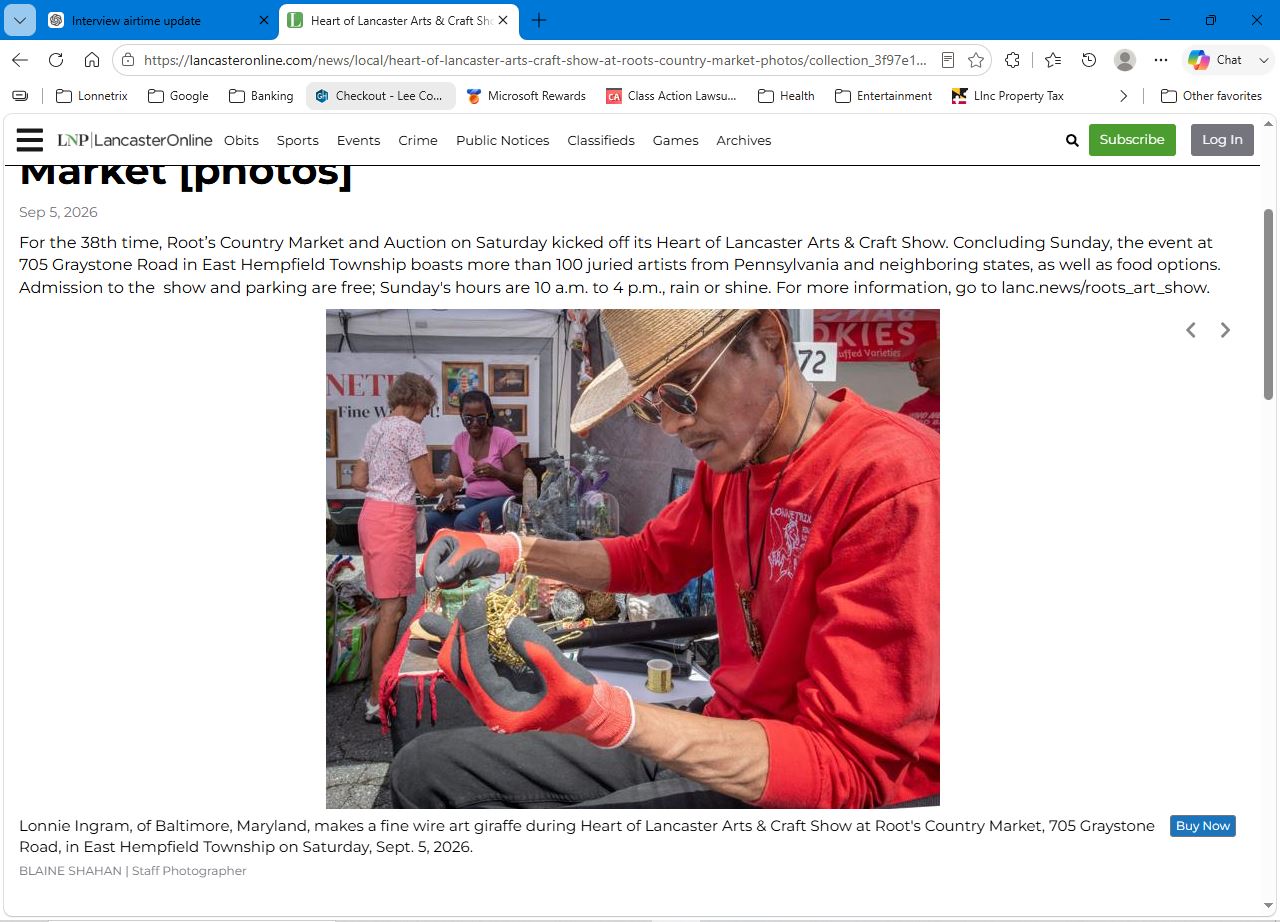 LancasterOnline newspaper clipping showing Lonnie Ingram making a wire giraffe at the Heart of Lancaster Arts and Craft Show, with the original caption and photographer credit